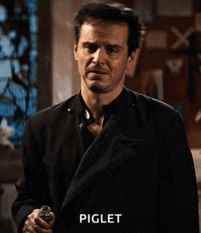 Man In Black Suit With Hands On Chest GIF