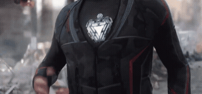 Man In Black Suit With Silver Heart GIF