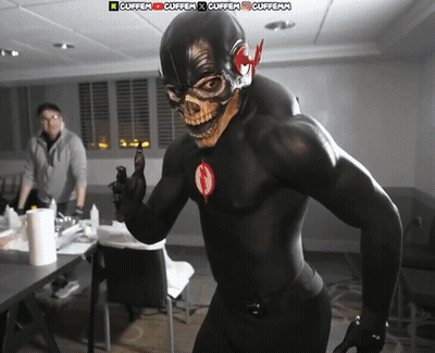 Man In Black Superhero Costume Standing Before Cuffen Sign GIF