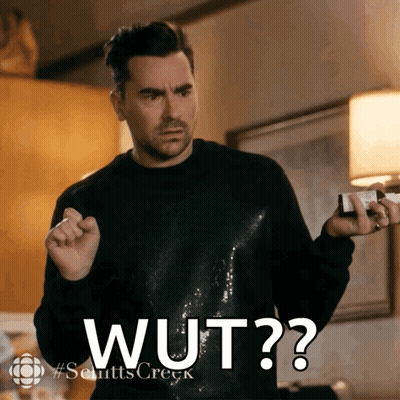 Man In Black Sweater Holding Bottle Saying Wut GIF