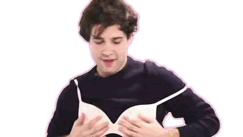 Man In Black Sweater Holding White Bra Sticker