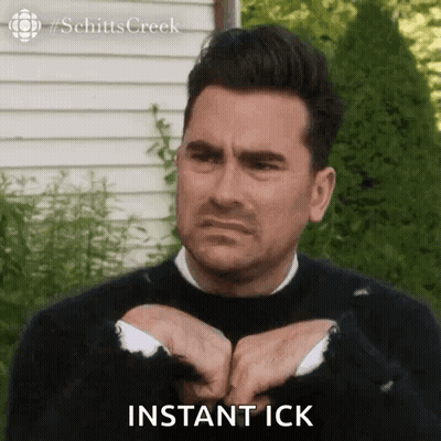 Man In Black Sweater Making Funny Face Saying Instant Ick GIF