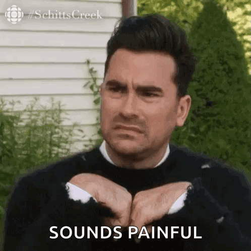 Man In Black Sweater Making Funny Face Says Sounds Painful GIF