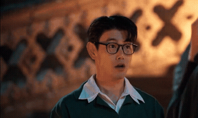 Man In Black Sweater On Yellow Couch Saying In Reality It's Just GIF