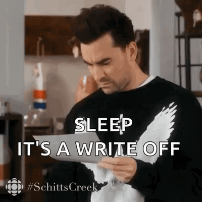 Man In Black Sweater Reading Paper GIF