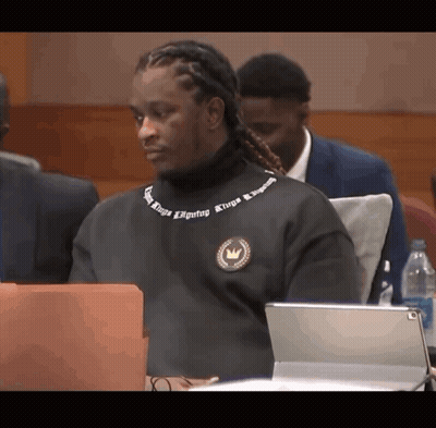 Man In Black Sweater Saying Kings On Neck GIF