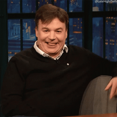 Man In Black Sweater Smiling And Pointing GIF