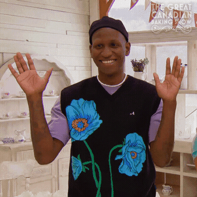 Man In Black Sweater With Blue Flowers GIF