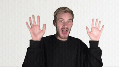 Man In Black Sweater With Funny Face And Hands Raised GIF
