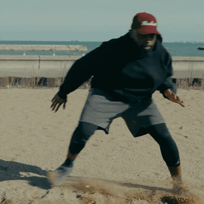 Man In Black Sweatshirt And Red SD Hat GIF