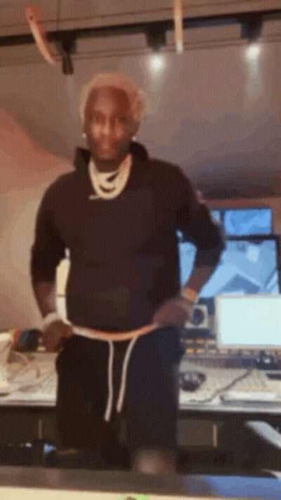 Man In Black Sweatshirt And Shorts Before Computer Monitor GIF