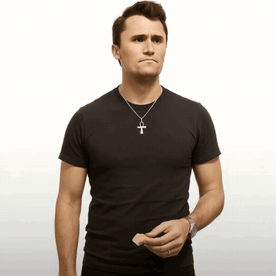 Man In Black T-Shirt And Silver Cross Necklace GIF