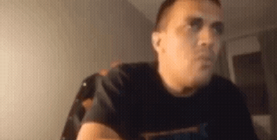 Man In Black T-Shirt Sitting At Table GIF