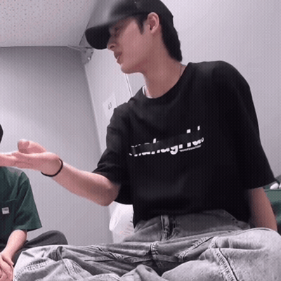 Man In Black T-Shirt Sitting GIF