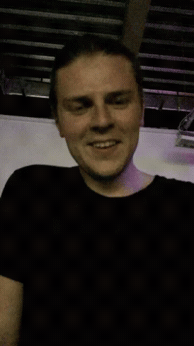 Man In Black T-Shirt Smiling GIF