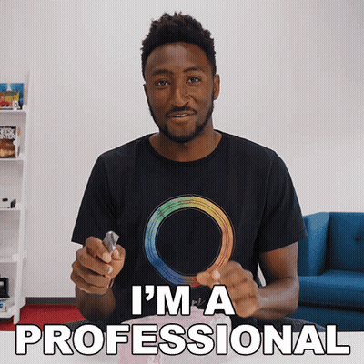 Man in Black T-Shirt With Rainbow Circle Says I'm a Professional