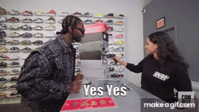 Man In Black Talking To Woman With Yes Yes Shirt GIF