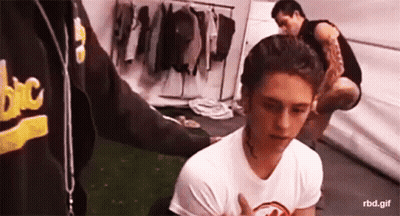Man In Black Tank Top And Suspenders Holding Guitar GIF