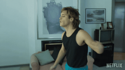 Man In Black Tank Top Dancing With Netflix Logo GIF