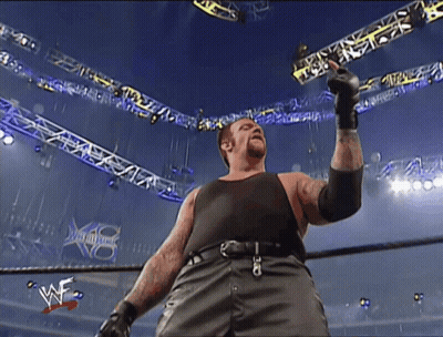 Man In Black Tank Top In Wrestling Ring GIF