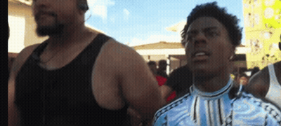 Man In Black Tank Top Next To Man In Blue Shirt GIF