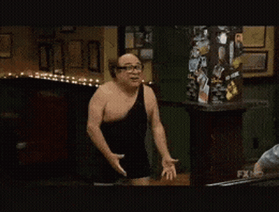 Man In Black Tank Top Next To Man In Gray Hoodie GIF
