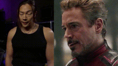 Man In Black Tank Top Next To Man In Red Suit GIF