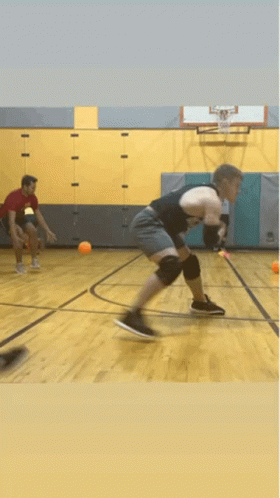 Man In Black Tank Top Playing Basketball GIF
