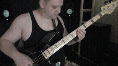 Man In Black Tank Top Playing Guitar GIF