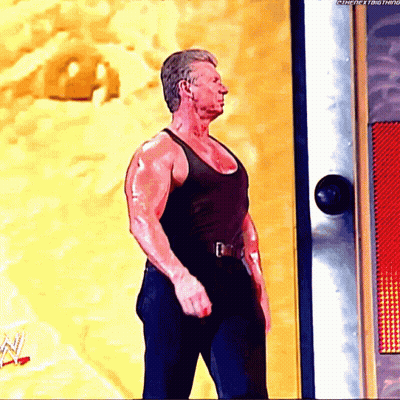 Man In Black Tank Top Standing In Front Of Door Saying Thenextthing GIF