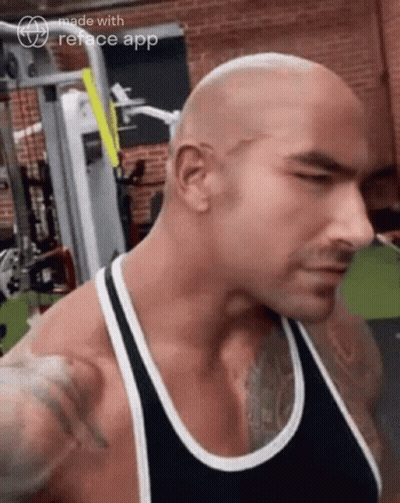 Man In Black Tank Top Standing In Gym GIF