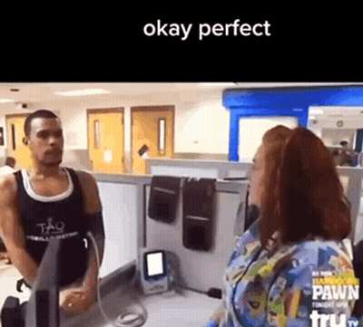 Man In Black Tank Top Talking To Woman GIF