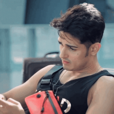 Man In Black Tank Top With Red Supreme Bag GIF