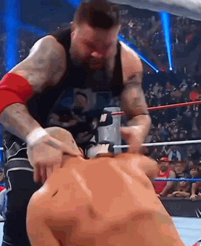 Man In Black Tank Top Wrestling Another Man GIF