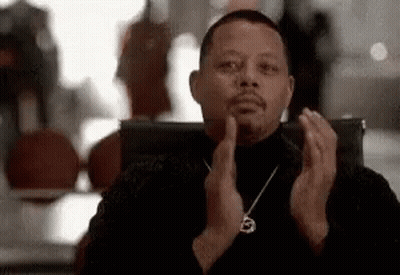 Man In Black Turtleneck Clapping In Chair GIF