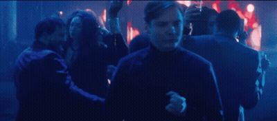 Man In Black Turtleneck Dancing In Crowd GIF