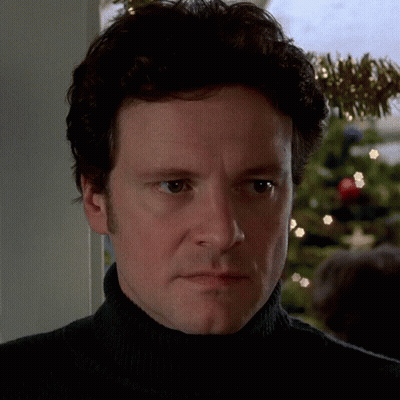 Man In Black Turtleneck Looking At Camera GIF