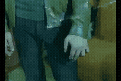 Man In Black Turtleneck Looking At Camera GIF