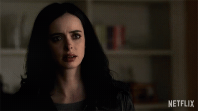 Man In Black Turtleneck Looking At Camera GIF