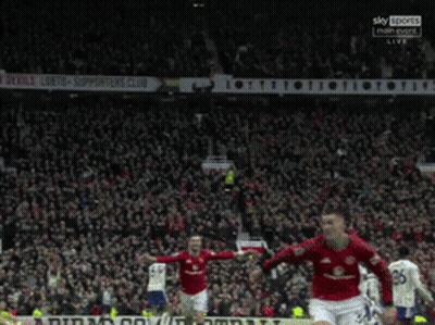 Man In Black Turtleneck Looks At Camera GIF