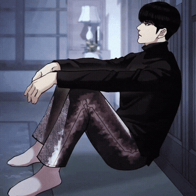 Man In Black Turtleneck Sitting Cross-Legged GIF