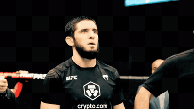Man In Black UFC Shirt Holding Arm Up GIF