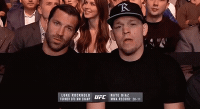 Man In Black UFC Shirt Standing Next To Another Man GIF