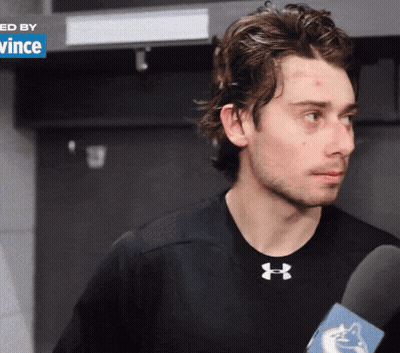 Man In Black Under Armour Shirt Holding Microphone GIF