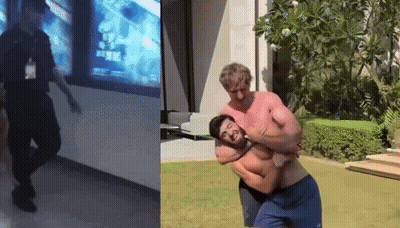 Man In Black Uniform Standing Next To Man In Blue Shorts GIF