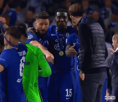 Man In Black Vest Next To Man In Green Soccer Jersey GIF