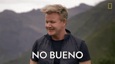 Man In Black Vest Says No Bueno In Mountains GIF
