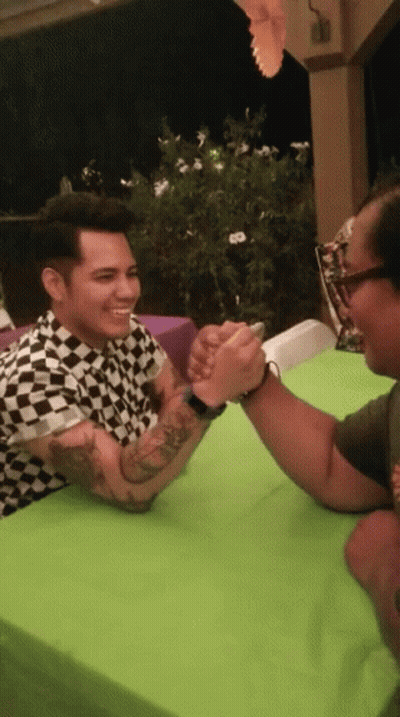 Man In Black White Checkered Shirt Arm Wrestling GIF