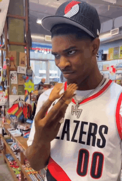 Man In Blazers Jersey Holding Barbie Doll GIF