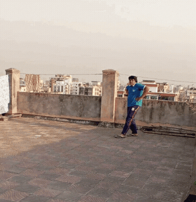 Man In Blue Adidas Shirt On Rooftop GIF